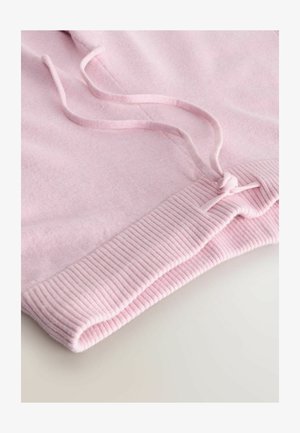 Lichtroze sweatshirtstof met een geribbelde zoom, voorzien van trekkoorden in de taille. Zachte textuur en een gladde afwerking.