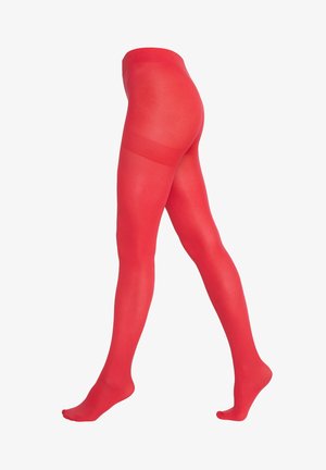 Beine mit leuchtend roten blickdichten Strumpfhosen in einer Gehpose vor weißem Hintergrund.