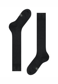 Un paio di calzini neri fino al ginocchio con la scritta "cotone" e le informazioni sulla taglia sulla parte del piede, distesi su uno sfondo bianco.