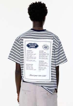Striped short-sleeve t-shirt featuring a white back panel with a menu design, listing pastries, savory items, and beverages, in navy blue text.