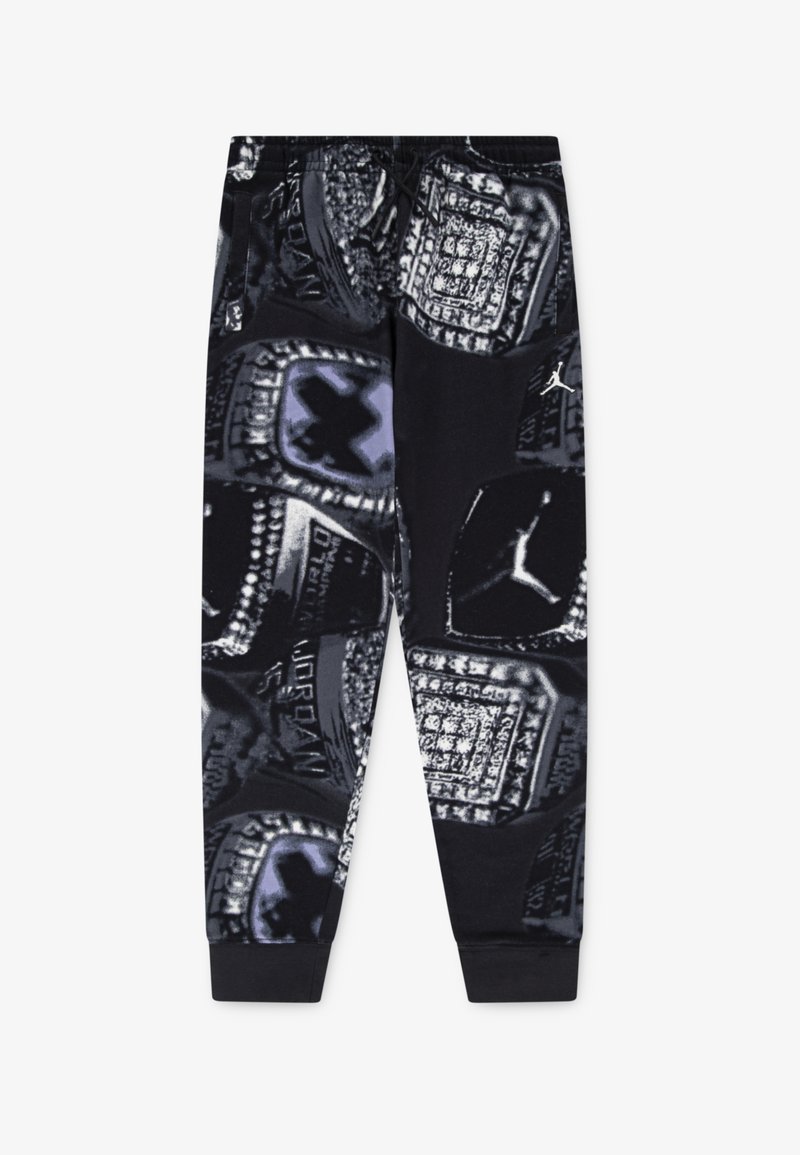 Pantalons de jogging noirs avec un imprimé graphique de bagues de championnat dans des tons gris et violet. Taille élastique avec cordon de serrage pour l'ajustement.