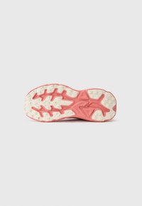 Shoe outsole featuring a pink rubber base with white textured grip patterns and chunky traction design, indicating cushioning and support.