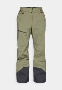 Pantaloni de zăpadă verde măsliniu cu tiv inferior și fermoare negre, având un sistem de închidere cu nasture și talie ajustabilă, fabricați dintr-un material durabil.