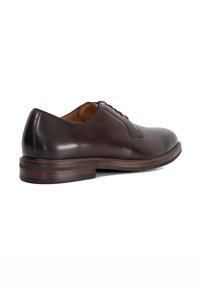 Brown leather dress shoe with a smooth texture, rounded toe, and a slightly raised heel. Features a lace-up design and contrasting stitching.