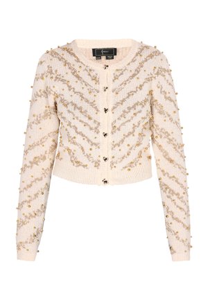 Cardigan bej tricotat cu decolteu rotund, ornamentat cu mărgele aurii și un model în zig-zag, având închidere cu nasturi și mansete cu nervuri.