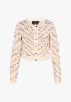 Cardigan bej tricotat cu decolteu rotund, ornamentat cu mărgele aurii și un model în zig-zag, având închidere cu nasturi și mansete cu nervuri.