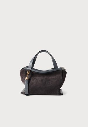 Dark suede bag with a rounded structure, leather handles, and gold hardware accents. Features a detachable strap for versatile carrying.