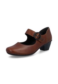 Chaussure Mary Jane en cuir marron avec une bride noire à boucle ronde et un petit talon empilé sur fond blanc.