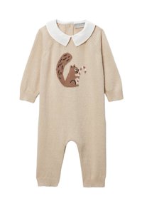 Combinaison en tricot beige à manches longues, avec un col Claudine blanc et un motif d'écureuil tenant une canne en sucre d'orge sur le devant.