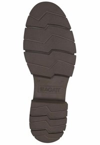 Suola in gomma marrone con un pattern testurizzato a zigzag e scanalature, etichettata "BAGATI" e taglia "37" nella sezione del tacco.