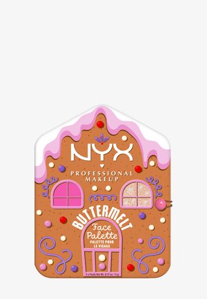 Gingerbread house-shaped makeup palette with a brown base, pink icing detail, colorful candy accents, and decorative windows in pink and glitter.