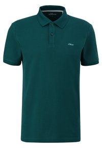 Polo shirt vert foncé en coton texturé, présentant une patte de boutonnage à deux boutons, des manches courtes et un petit logo brodé sur la poitrine.
