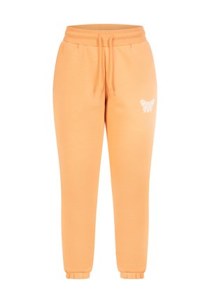 Oranje joggingsbroek van zachte stof, met een elastische tailleband met trekkoord en een vlinderontwerp geborduurd op de linker bovenbeen.