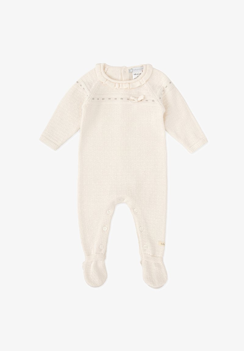 Monosie de punto color crema con mangas largas, cuello con volantes, detalles de botones y diseño con pies. Patrón texturizado en toda la prenda.