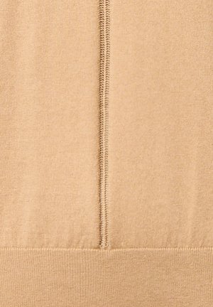 Tissu en tricot beige avec un léger éclat. Présente une couture centrale avec des points visibles et un ourlet côtelé au bord inférieur.