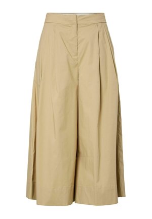 Pantalon beige coupe large et raccourcie avec plis à l'avant et fermeture avant dissimulée, en tissu léger.