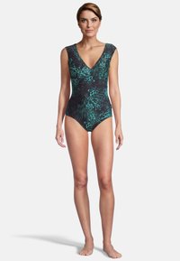 Maillot de bain noir une pièce avec un décolleté en V, orné de motifs floraux teal et avec des manches courtes. Texture lisse avec une silhouette ajustée.