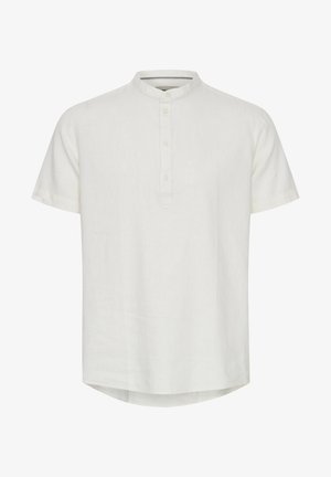 Koszula z krótkim rękawem w kolorze kości słoniowej, wykonana z lnu. Posiada okrągły kołnierzyk i zapięcie na trzy guziki. Dół jest delikatnie zaokrąglony.