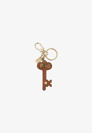 Portachiavi con un design a chiave marrone e una chiusura dorata. La chiave presenta una testa circolare con un dettaglio della mappa e un piccolo logo.