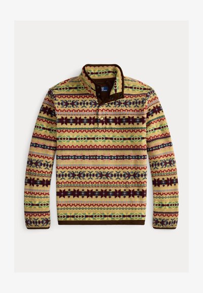 Suéter de punto multicolor con base amarilla que presenta rayas verticales y patrones florales en púrpura, verde y azul; cuello y ribete marrón.