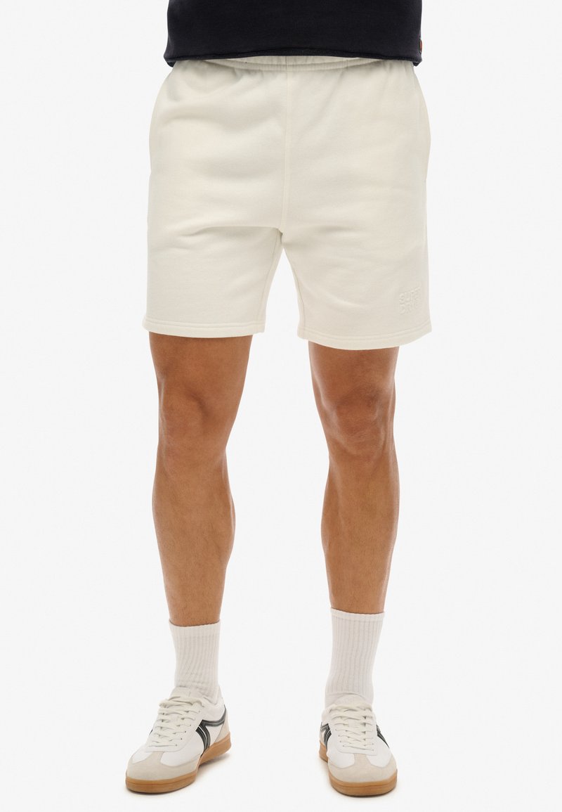Superdry & Co EMBOSSED - Pantalon de survêtement - new chalk white