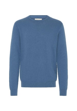 Sinine kudumiga särk, millel on tekstuuriline muster, ümmargune kaelus ning ribakujulised mansetid ja ääred. Valmistatud kergest materjalist.