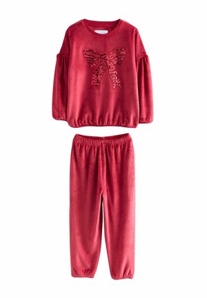 Red, plush two-piece outfit featuring a long-sleeve top with a sequined bow design and elastic-waist pants. Soft texture throughout.