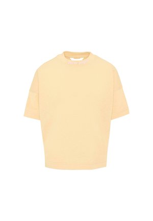 Beżowy crop top z krótkim rękawem, okrągłym dekoltem i małym białym napisem nadrukowanym na przedniej części dekoltu.