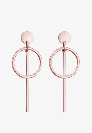 Boucles d'oreilles créoles en or rose présentant un design circulaire avec un accent en barre verticale. Fini métallique lisse avec des surfaces polies et des bords arrondis.