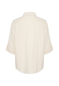 Light beige linen shirt with a turned-up collar, three-quarter sleeves, and a loose fit. Smooth texture with no visible patterns.
