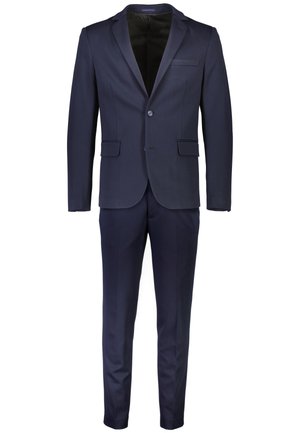 Costume bleu marine avec un design ajusté, fermeture à un bouton, deux poches avant et un tissu lisse avec une légère brillance.