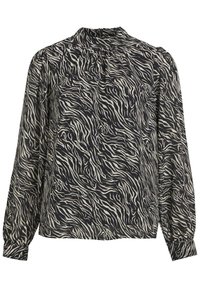 Blouse à manches longues en tissu léger, présentant un motif zèbre noir et crème, avec un col montant et des détails froncés sur les manches.
