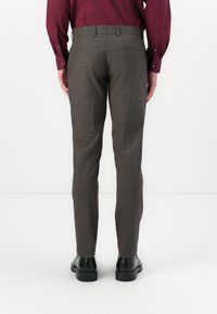 Gray checkered trousers with a tailored fit, featuring a subtle pattern, belt loops, and a single back pocket. Smooth fabric with a structured shape.
