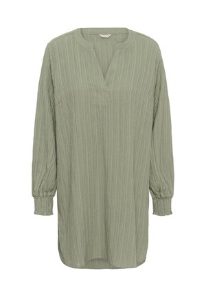 Green long-sleeve top with a textured, ribbed design. Features a v-neckline and gathered cuffs. Relaxed fit, with a slightly longer back.