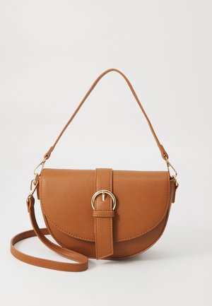 Brown leather crossbody bag with a curved shape, gold hardware, and a buckle accent. Features a detachable shoulder strap.