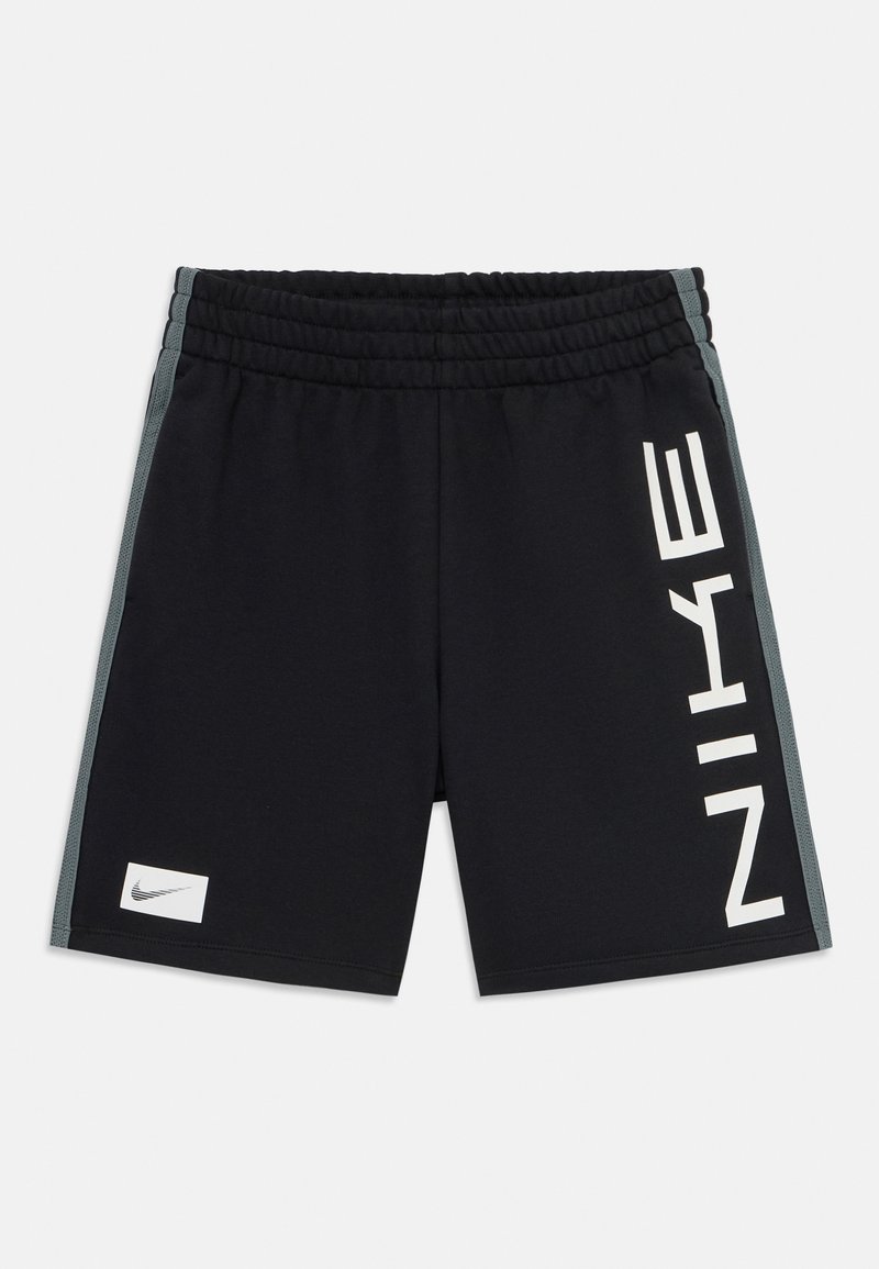 Black athletic shorts made of polyester, featuring a wide elastic waistband, side gray panels, and a large white "NIKE" logo.