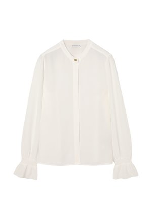 Valge pluus, kerge kangas, nööpkinnitus, ümar krae, pikad varrukad kogutud mansettidega, sile tekstuur, peen läige.