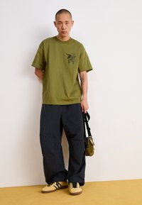 Carhartt WIP JUDD PANT - Trousers - black stone dyed