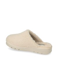 Pantofole beige con un esterno morbido e peloso, apertura sul retro e una suola spessa con scanalature per la trazione. Design della punta arrotondata.