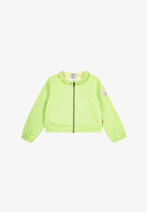 Veste enfant vert clair à manches longues avec fermeture éclair sur le devant, col à volants, poignets élastiques et petit patch ours en peluche sur la manche gauche.