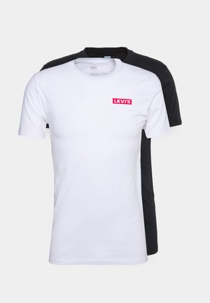 Two t-shirts: one white with a red "LEVI'S" logo, and one black. Both have short sleeves and a round neckline. Standard cotton fabric.