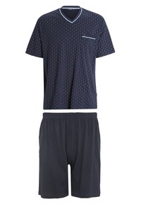 Marineblauwe pyjama-set met een T-shirt met korte mouwen en V-hals, voorzien van een klein zakje, en bedekt met witte stippen, met bijpassende shorts met elastische taille.