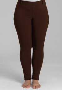 Braune Leggings aus einem glatten, dehnbaren Stoff mit enganliegendem Schnitt und hoher Taille. Minimalistischer Stil ohne sichtbare Hardware.