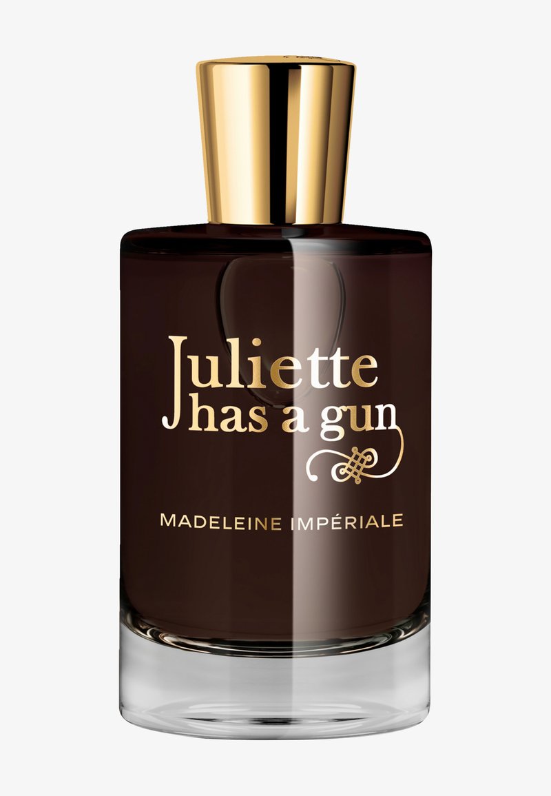 Flacon de parfum brun foncé avec bouchon doré, étiqueté « Juliette has a gun Madeleine Impériale » en texte doré et blanc.