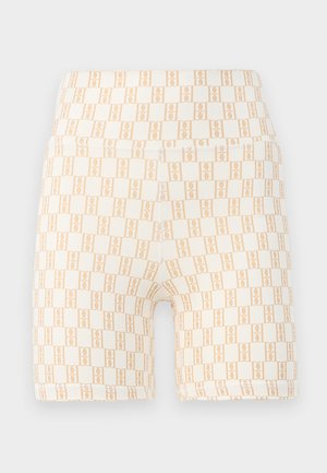Shorts de vélo en crème légère avec un motif géométrique pêche sur l'ensemble. Tissu doux et extensible avec une taille large.
