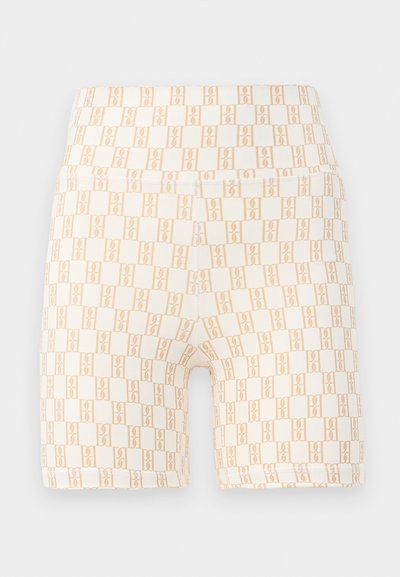 Bicycle shorts in light cream with an all-over peach geometric pattern. Soft, stretchy fabric with a wide waistband.