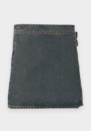 Denim wrap skirt in dark blue with a textured surface, featuring two side buckles and a straight hem. Stitched seams visible along edges.
