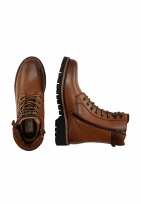 Braune Lederwanderstiefel mit runder Zehenpartie, seitlichem Reißverschluss, Metallösen und einer profilierten schwarzen Gummisohle. Texturiertes Obermaterial und gepolsterter Kragen.