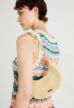 Beige woven handbag with a crescent shape, featuring a gold chain strap adorned with pearls and a starfish accent. Smooth texture.