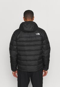 The North Face ACONCAGUA HOODIE - Casaco de penas - black